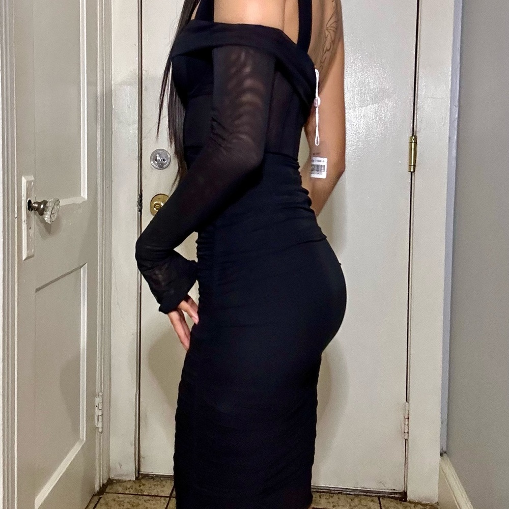 This dress is from oh Polly. The size is 0. It is new